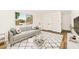 Bright living room with a neutral color palette, large window, and stylish furnishings creates a welcoming space at 5078 Mountain Vista St, Las Vegas, NV 89120