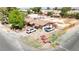 Drone shot of a property, featuring a house, yard, outbuildings, and parking space at 5262 Harris Ave, Las Vegas, NV 89110