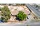 Aerial view of a home with mature trees, an American flag, and several parked cars at 5262 Harris Ave, Las Vegas, NV 89110