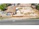 An aerial shot showing the property, house, yard, outbuilding, and vehicles in the parking area at 5262 Harris Ave, Las Vegas, NV 89110