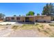 Rear of house and outbuildings, showing yard and exterior of the home at 5262 Harris Ave, Las Vegas, NV 89110