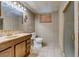 This bathroom features a sink with marble counter, a toilet, and a glass-enclosed shower at 5262 Harris Ave, Las Vegas, NV 89110