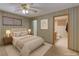 Cozy bedroom with soft lighting, calm colors, and convenient access to a private bathroom at 5262 Harris Ave, Las Vegas, NV 89110