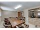 Spacious dining room with tile flooring, large window, and a sizable wooden table perfect for Gathering gatherings at 5262 Harris Ave, Las Vegas, NV 89110