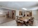Dining area featuring a spacious table that seats eight, adjacent to living area with a fireplace at 5262 Harris Ave, Las Vegas, NV 89110