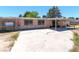The backyard exterior features a concrete patio and the back side of the home and outbuildings at 5262 Harris Ave, Las Vegas, NV 89110