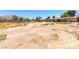 A vacant land for sale with a single-Gathering home in the background at 5262 Harris Ave, Las Vegas, NV 89110