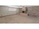 Living room featuring tile floors, a fireplace, and a large window for plenty of natural light, cozy relaxation at 5262 Harris Ave, Las Vegas, NV 89110