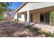 Backyard features a covered patio with seating area and gravel landscaping at 5412 Dalle Valley St, North Las Vegas, NV 89031
