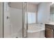 Bathroom showcasing a glass shower, bathtub and chrome shower head at 5412 Dalle Valley St, North Las Vegas, NV 89031