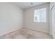 Cozy bedroom with neutral carpet, and bright natural light from the window at 5412 Dalle Valley St, North Las Vegas, NV 89031