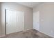 Bedroom with neutral carpet, built-in closet, and bright lighting at 5412 Dalle Valley St, North Las Vegas, NV 89031
