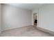 Spacious bedroom with neutral carpet and a view to an attached bathroom at 5412 Dalle Valley St, North Las Vegas, NV 89031