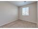 Well-lit bedroom with neutral carpet, and bright natural light from the window at 5412 Dalle Valley St, North Las Vegas, NV 89031