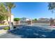 The gated entrance provides security for the community and is enhanced with a stone facade, landscaping, and palm trees at 5412 Dalle Valley St, North Las Vegas, NV 89031