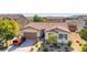 Inviting single-story home with manicured yard, brick driveway, and a convenient two-car garage at 5412 Dalle Valley St, North Las Vegas, NV 89031