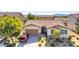 Charming single-story home with a manicured front yard and brick driveway; 2 car garage at 5412 Dalle Valley St, North Las Vegas, NV 89031