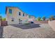 Backyard with gravel, and patio with sliding glass door access to the home at 5852 Brown Tree Ln, North Las Vegas, NV 89081