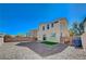 Backyard view shows the gravel landscape and artificial turf at 5852 Brown Tree Ln, North Las Vegas, NV 89081