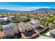 Backyard with gravel and artificial turf, complemented by green space for outdoor activities and relaxation at 5852 Brown Tree Ln, North Las Vegas, NV 89081