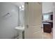 Charming powder room features a pedestal sink, and modern fixtures at 5852 Brown Tree Ln, North Las Vegas, NV 89081