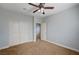 Spacious bedroom has carpet, ceiling fan, and a closet at 5852 Brown Tree Ln, North Las Vegas, NV 89081