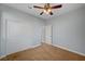 A carpeted bedroom with a closet and an open doorway to other parts of the home at 5852 Brown Tree Ln, North Las Vegas, NV 89081