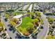 Aerial view of a vibrant community park, complete with green space, playground, and walking paths at 5852 Brown Tree Ln, North Las Vegas, NV 89081