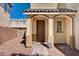 Covered front porch featuring brick pavers, and columns in front of the front door at 5852 Brown Tree Ln, North Las Vegas, NV 89081