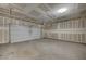 Empty two car garage with drywall and primed walls at 5852 Brown Tree Ln, North Las Vegas, NV 89081