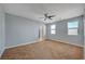 Spacious primary bedroom features neutral walls, ample natural light, and a ceiling fan at 5852 Brown Tree Ln, North Las Vegas, NV 89081