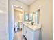 This newly updated bathroom features dual mirrors, modern vanity, and clean finishes at 6420 Little Pine Way, Las Vegas, NV 89108