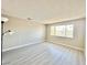 A bright, spacious bedroom with neutral paint and large window at 6420 Little Pine Way, Las Vegas, NV 89108