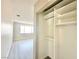 View of an organized closet with shelving in a room with light gray wood flooring and a large window at 6420 Little Pine Way, Las Vegas, NV 89108