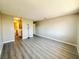 The open-concept living room boasts sleek vinyl flooring and neutral paint at 6420 Little Pine Way, Las Vegas, NV 89108