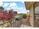 Balcony view featuring iron railing, nearby trees, and mountain views in the distance at 721 Bourbon St # F2, Pahrump, NV 89048