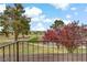 Scenic balcony view overlooking the golf course and mature landscaping, offering a serene outdoor living space at 721 Bourbon St # F2, Pahrump, NV 89048