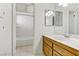 Bathroom featuring a wooden vanity and a shower-tub combo at 721 Bourbon St # F2, Pahrump, NV 89048