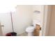 Cozy bathroom features tiled floors, white toilet, and vanity with a wood-stained cabinet at 721 Bourbon St # F2, Pahrump, NV 89048