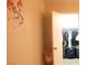 A cozy bedroom with a walk-in closet and floral wall decor at 721 Bourbon St # F2, Pahrump, NV 89048