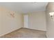 Carpeted bedroom features neutral walls and a white door at 721 Bourbon St # F2, Pahrump, NV 89048