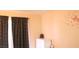 Bedroom features an accent wall decal, a white dresser, and heavy dark curtains at 721 Bourbon St # F2, Pahrump, NV 89048
