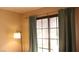Bedroom view showcasing curtains and outdoor lighting at 721 Bourbon St # F2, Pahrump, NV 89048