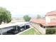 Exterior shot of a home with covered parking, mountain views, landscaping and red tile roofing at 721 Bourbon St # F2, Pahrump, NV 89048