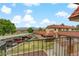 Exterior view of townhome with covered parking, mature trees, and landscaping at 721 Bourbon St # F2, Pahrump, NV 89048