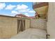 Exterior view of a townhome's side yard with a shed and block wall at 721 Bourbon St # F2, Pahrump, NV 89048