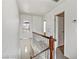 Hallway with stairway leading to the first floor, enhanced with natural light at 721 Bourbon St # F2, Pahrump, NV 89048