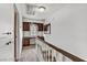 Upstairs hallway featuring a built-in desk, window, and neutral decor at 721 Bourbon St # F2, Pahrump, NV 89048