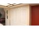 View of the hallway reveals neutral walls, storage closet, and convenient access to other parts of the home at 721 Bourbon St # F2, Pahrump, NV 89048