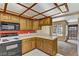 A well-lit kitchen boasting a microwave, range, and view to a balcony, creating a functional and bright space at 721 Bourbon St # F2, Pahrump, NV 89048